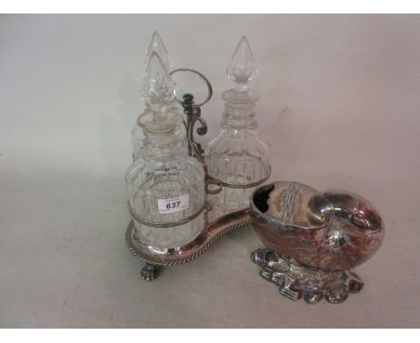Silver plated three bottle decanter stand with cut glass bottles and a silver plated nautilus shell spoon warmer