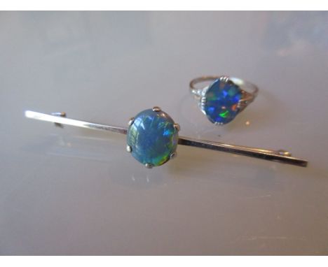 Art Deco white metal and black opal ring with diamond set shoulders together with a similar bar brooch