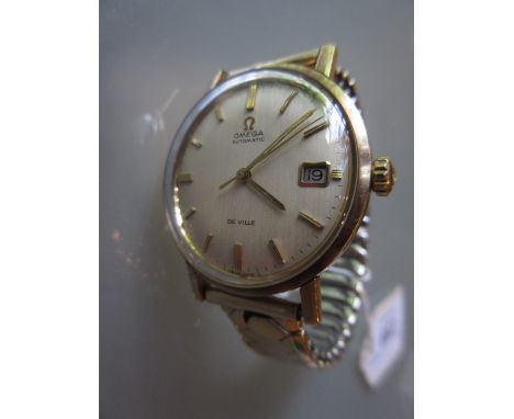 Gentleman's 9ct gold Omega Seamaster Automatic De Ville wristwatch, the champagne dial with baton numerals, sweep seconds han