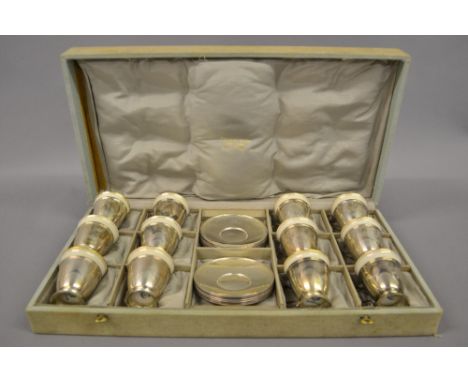 Set of twelve Tiffany and Co. sterling silver teacups with saucers and ceramic liners in original silk lined and canvas case