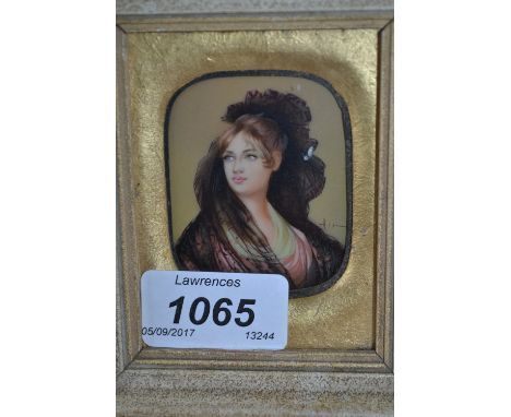 Miniature head and shoulder portrait of a lady wearing a black lace headdress, rectangular framed