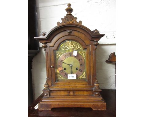 German walnut cased mantel clock with brass dial and two train movement striking on a gong