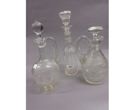 Two 19th Century glass jug decanters with stoppers and another glass decanter with stopper