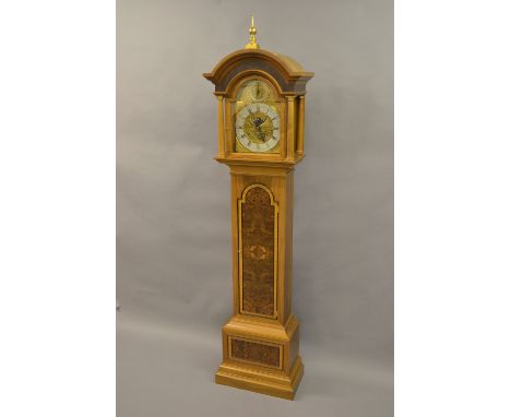 Walnut and burr walnut longcase clock, the broken arch hood with flanking pilasters above an arched crossbanded door and conf