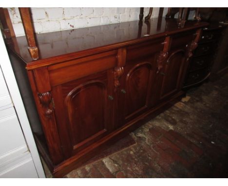 Reproduction mahogany chiffonier, the shelf back with carved surmount above three drawers and three dome topped panelled door