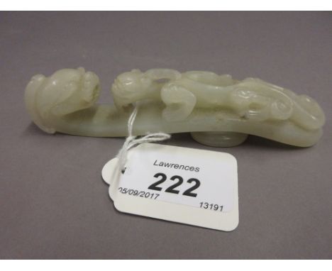 19th Century Chinese carved pale jade belt loop in the form of a dragon