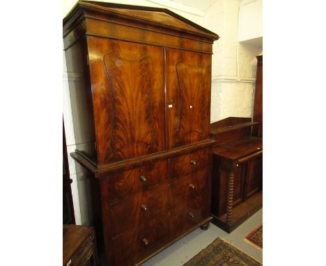 Large 19th Century flame mahogany linen press having architectural cornice above two panelled doors over two short and two lo