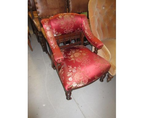 Small 19th Century nursing chair having spindle back and turned tapering front supports with brass and ceramic casters