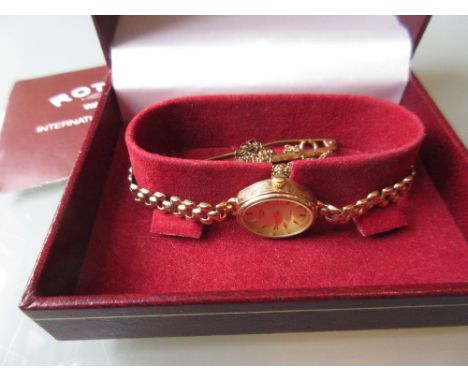 Ladies Rotary 9ct gold cased wristwatch with gold integral strap together with a neck chain and a tie pin (a/f)