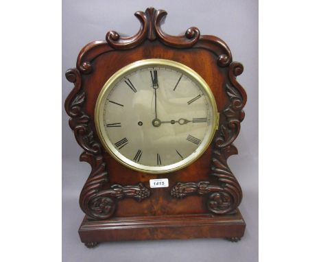 William IV mahogany bracket clock, the shaped case with applied carved floral decoration, the circular silvered dial with Rom