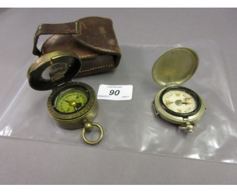 Army and Navy Patent military compass with leather case together with another compass