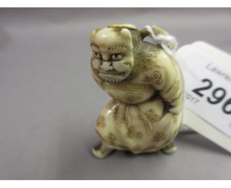 Japanese Meiji period carved ivory netsuke in the form of a Kabuki actor wearing a mask and holding a sword, a pasted label t