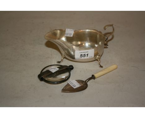 Sheffield silver sauce boat, silver mounted magnifying glass and a small plated trowel