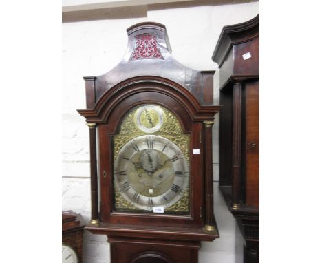 George III mahogany longcase clock, the arched hood above an arched panelled door and a rectangular plinth with bracket feet,