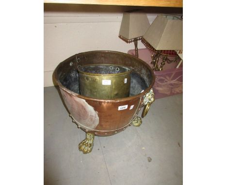 Copper coal bin on brass supports together with a brass jardinière and a wooden firescreen