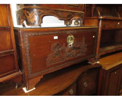 Far Eastern camphor wood trunk with carved decoration