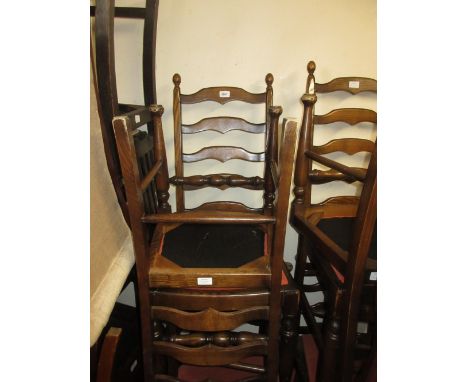 Set of eight reproduction elm ladder back dining chairs with drop-in seats raised on turned front supports