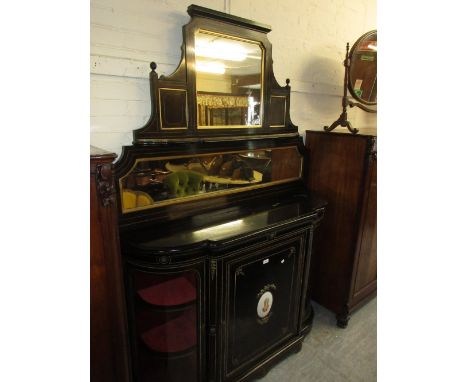 19th Century ebonised and gilt metal mounted credenza with a mirrored and gallery shelf back above a semi bow fronted base wi