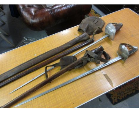 George V sword with shagreen and wire twist grip having pierced and engraved basket and leather covered scabbard together wit