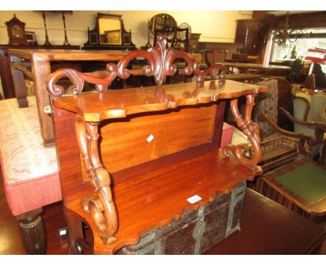 19th Century mahogany two shelf wall bracket with scroll surmount