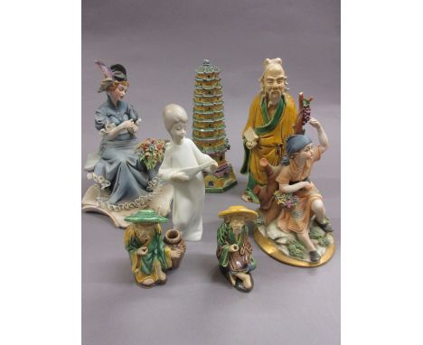 Two Capo di Monte figures of ladies, three Chinese pottery figures, similar pagoda ornament and a Spanish porcelain figure