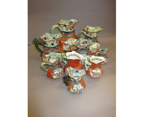 Group of nine 19th Century Masons Ironstone octagonal jugs with chinoiserie decoration on a red scale ground