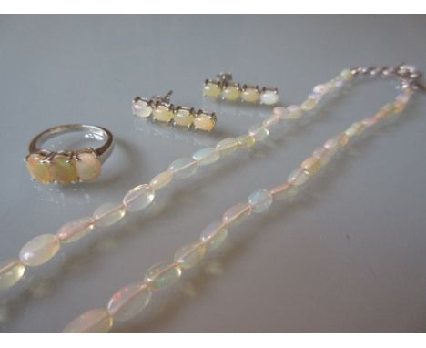 Opal necklace, ring and earrings, each mounted in silver