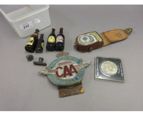 British Columbia automobile car badge, light meter, coin, four miniature bottles and two seals