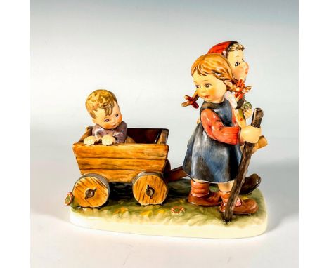 Part of the Century Collection. Hand painted in matte finish, two girls pushing a boy in a wooden cart. Goebel backstamp. Thi