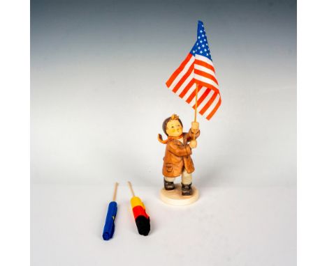 Hand painted in matte finish. Boy proudly holds a flag in hand. Includes an American flag, a German flag and the flag of Euro