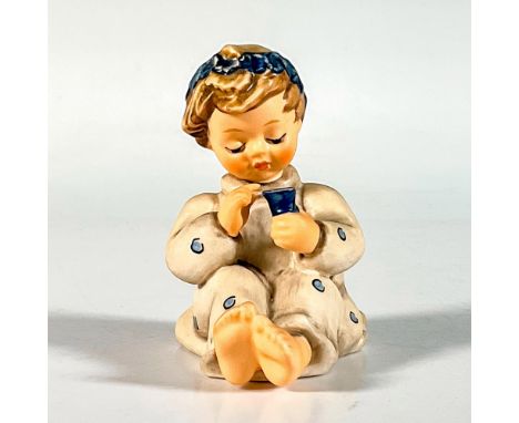 Hand painted in matte finish. Young girl seated admiring a flower. First Issue 1996. Goebel Hummel backstamp. This item has i