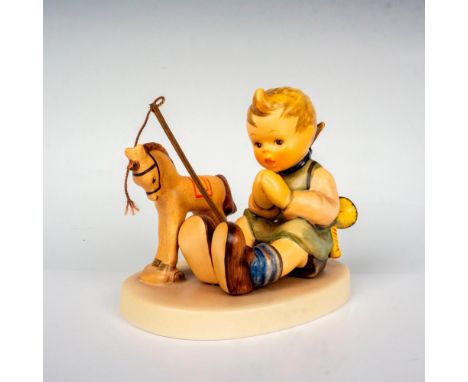 Hand painted in matte finish. Young child sitting down in prayer by her rocking horse. 1997/1998 M. I. Hummel Club Exclusive 