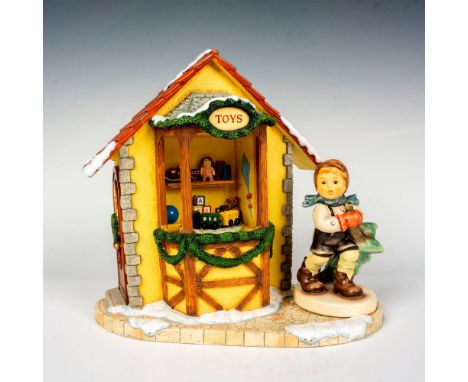 Hand painted figurine, Coming From The Woods (HUM 2241), and musical base, Holiday Dreaming, that plays Oh Tannenbaum. Goebel