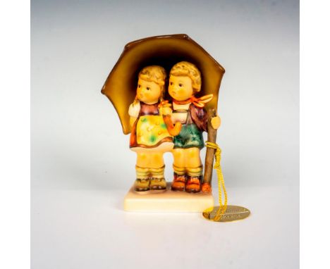 Hand painted in matte finish. Cute, vintage figure of a boy and girl under an umbrella. Comes with hang tag medallion, celebr