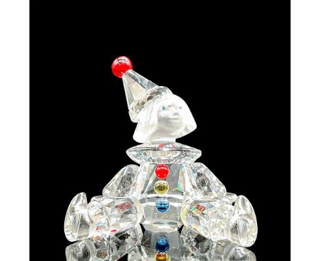 Lead crystal part of Cheerful Times collection and made with frosted face with blue, red, and yellow colored buttons. Swarovs