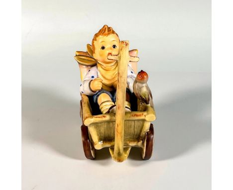 Hand painted in matte finish. Young boy delightfully sits in a wagon, accompanied by a small bird. 1994 first issue. Goebel b