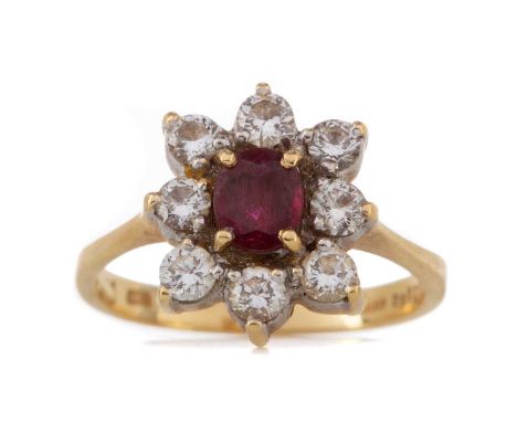 RUBY AND DIAMOND CLUSTER RING, the oval ruby within a round brilliant cut diamond halo totalling approximately 0.80 carats, i