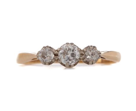 DIAMOND THREE STONE RING,the central round brilliant cut diamond of approximately 0.20 carats, flanked by old cut diamonds to
