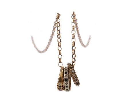 GOLD CHAIN WITH THREE ATTACHED RINGS,including a ruby and diamond ring in eighteen carat gold, along with two unmarked gem se