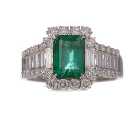 EMERALD AND DIAMOND RING,the emerald cut emerald of approximately 1.59 carats, flanked by baguette cut diamonds, bordered by 