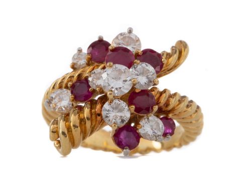 RUBY AND DIAMOND RINGset with round rubies and round brilliant cut diamonds totalling approximately 0.70 carats, to a ropetwi