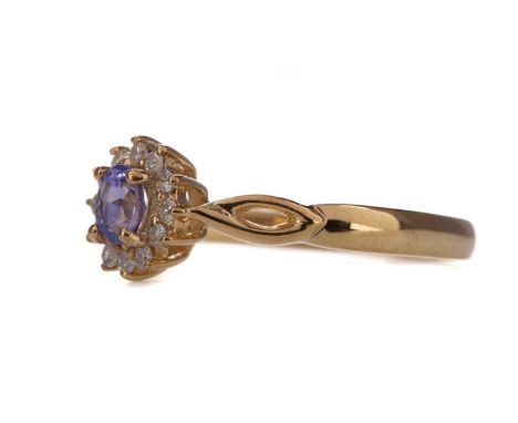 TANZANITE AND DIAMOND RING,the oval tanzanite of approximately 0.22 carats, within a halo of round brilliant cut diamonds tot