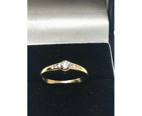 Fine 18ct gold diamond ring central diamond measures approx 3.5mm dia with diamond shoulders weight 2.4g 