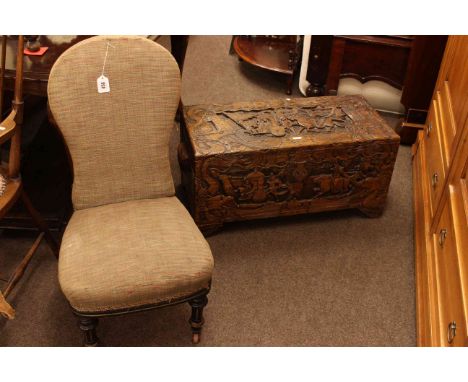 Carved camphorwood trunk and Victorian ebonised nursing chair (2)