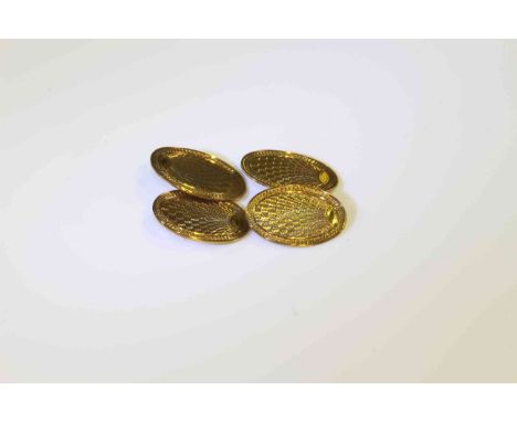 Pair 9 carat gold oval engine-turned cufflinks