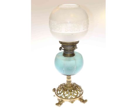 Victorian ornate pierced brass based oil lamp with Nailsea glass reservoir and etched and frosted shade