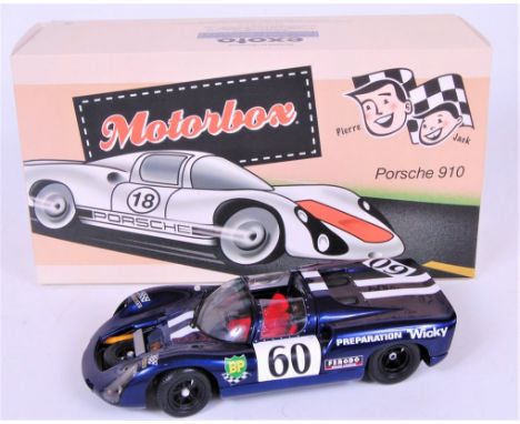 Exoto, 1/18th scale diecast model of a Porsche 910, finished in dark metallic blue, with Racing Livery, in the original polys