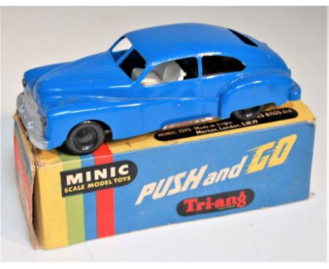 Triang Minic Post War, Friction Drive Ford Tudor, blue plastic body with black plastic hubs, in the original all card box (NM