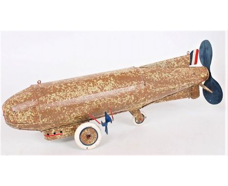 An Unusual repainted tinplate and battery operated model of a Air ship, finished in brown and light green, with 2 propellers,