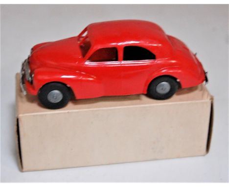 Triang Minic Post War, Morris Oxford, friction drive, red plastic body with cast hubs, chrome grille, in the original white a